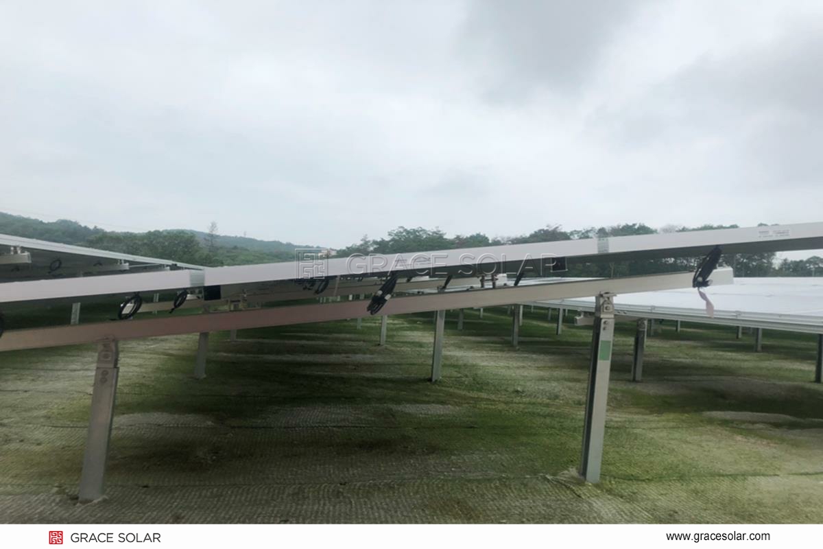 Engineers installing wind-proof GS-Energy system on metal roof in Osaka